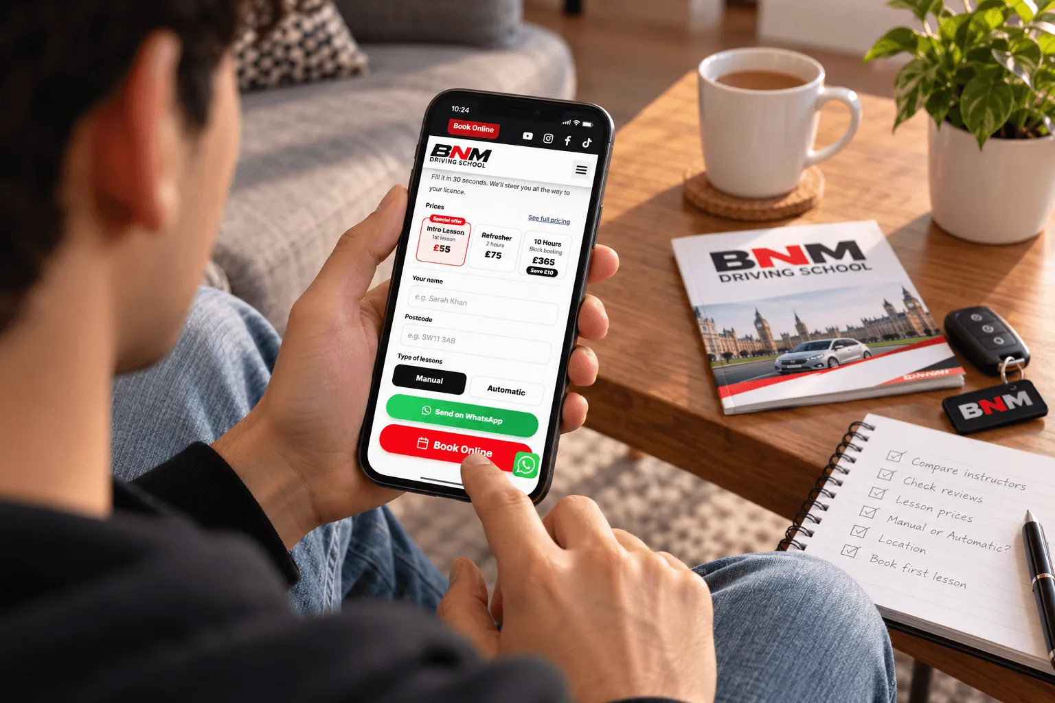 Learner checking BNM lesson prices on a phone next to a driving instructor checklist